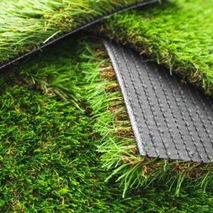 Detail of types of artificial grass in a sample book.
